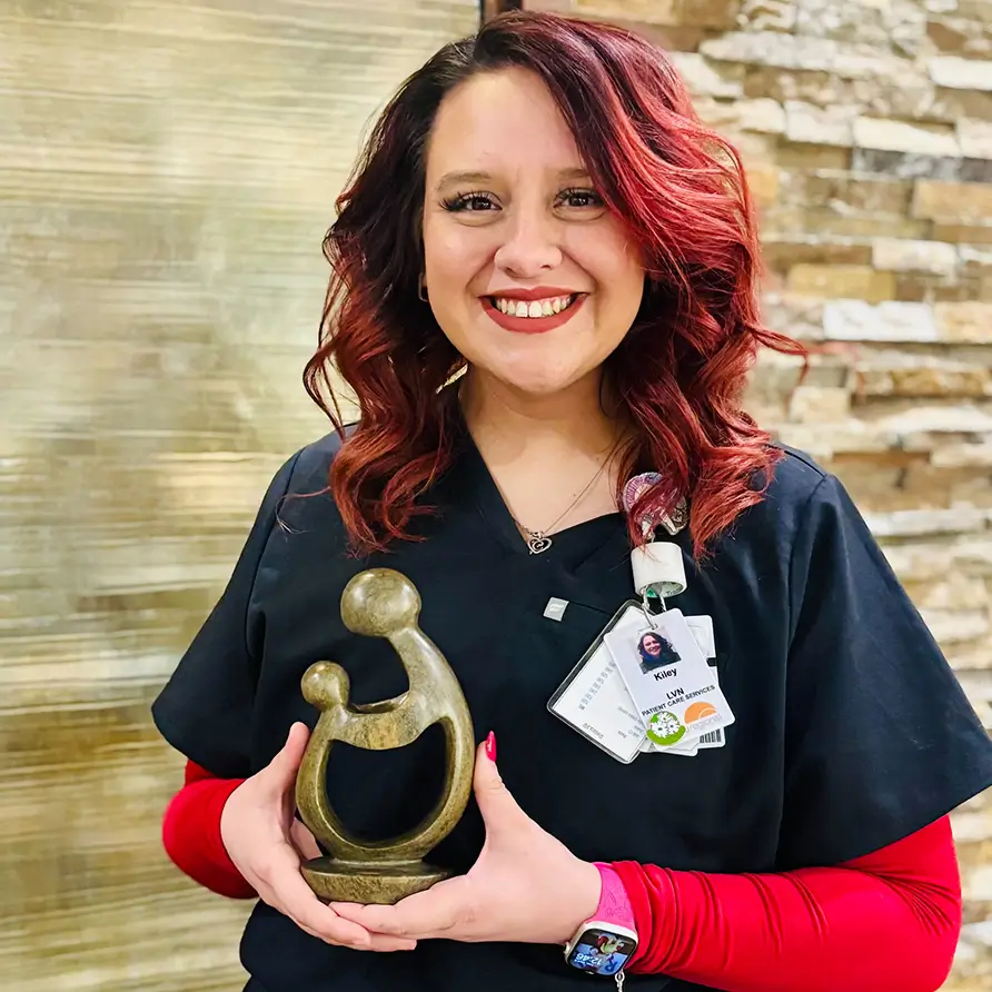 Kiley Armstrong with Award