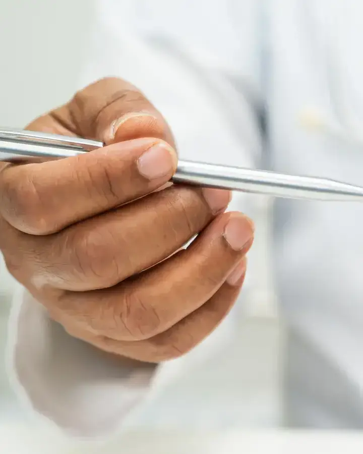 a doctor holding a model of the heart