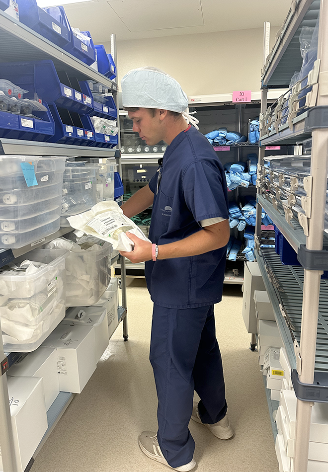 Student-Volunteer-with-surgical-supplies Student-Volunteer-with-surgical-supplies