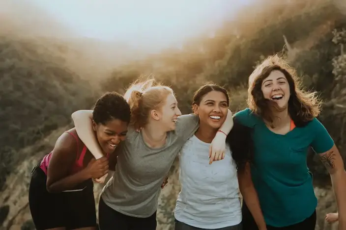 four women in mountains