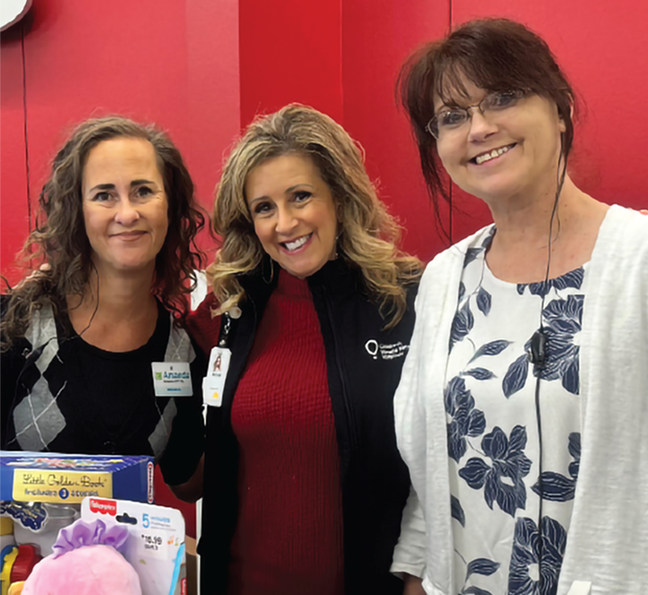Three smiling women on red background