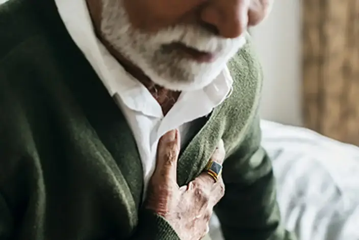 a man wearing a green sweater