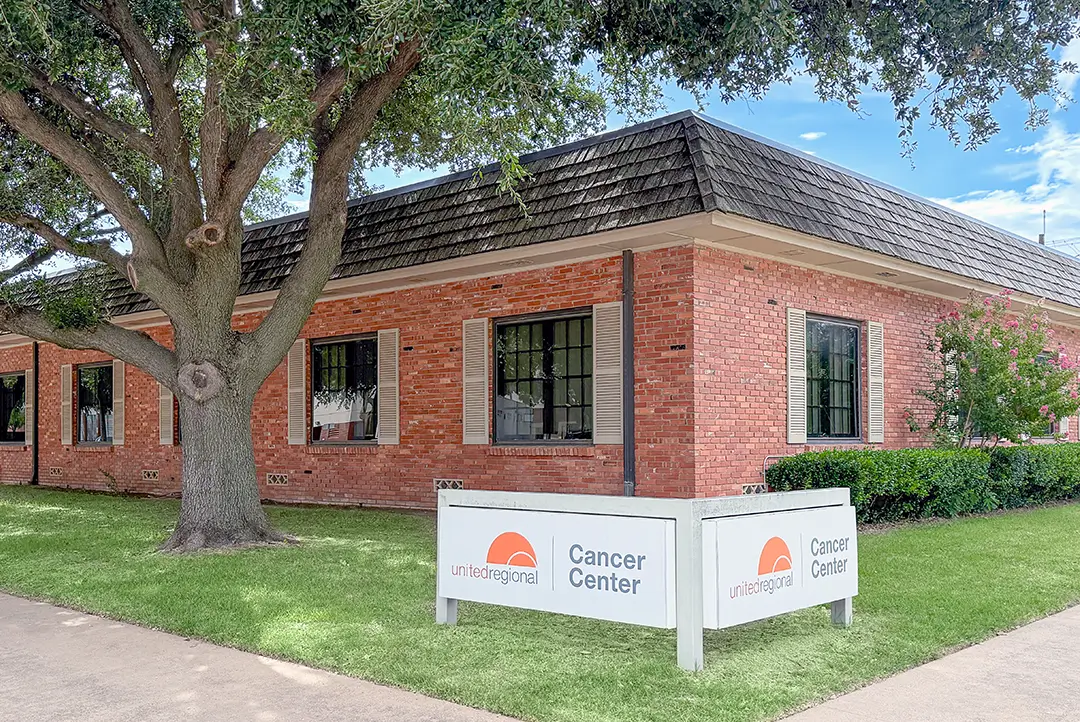 cancer center wichita falls side view of orange brick building with white sign