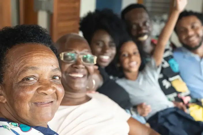 group of happy people sitting together