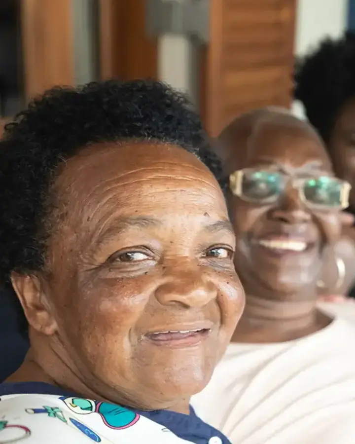 group of happy people sitting together