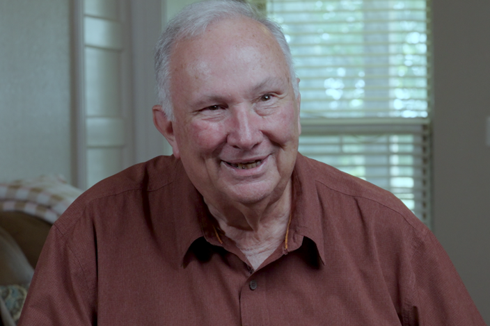 Older-man-in-red-shirt-smiling